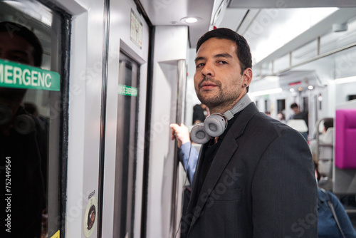 latino man riding the subway