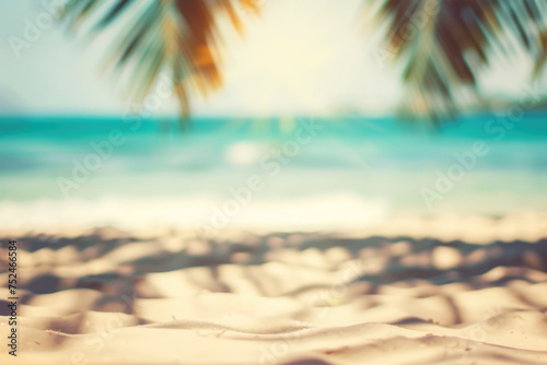 Tropical beach with palm trees, sand, waves and sun light, defocused abstract background with copy space © pilipphoto