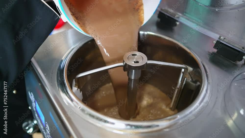 putting mixture into the pasteurization machine rotating to pasteurize icecream. High quality 4k footage