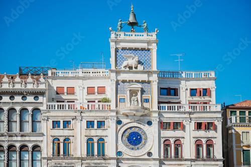 St Mark Clocktower with clock and statues. View from Piazza San Marco, Venice, Italy photo