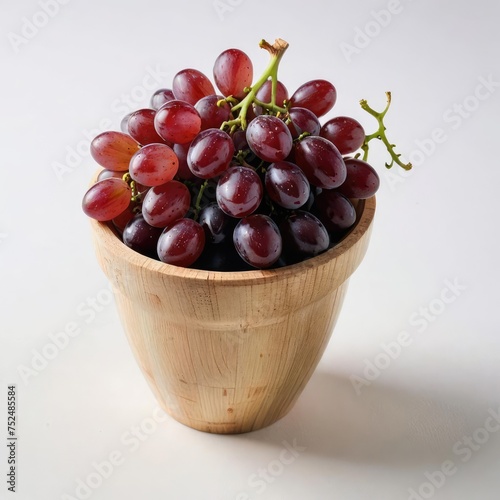 grapes in a bowl on white 