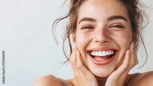 The girl's joyful smile illuminates the photo, revealing her beautiful, meticulously-cared-for teeth.