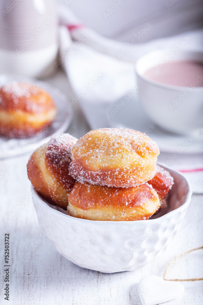 Donuts with sugar and cinnamon served with cocoa. Traditional dessert for Carnival.