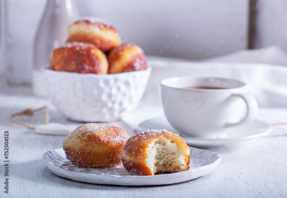 Donuts with sugar and cinnamon served with cocoa. Traditional dessert for Carnival.