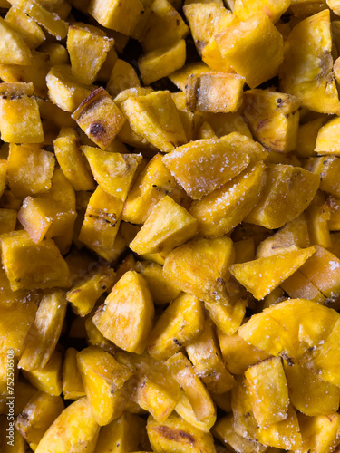 Close up of traditional fried green plantain, typical gastronomy from latin america. Textured image.