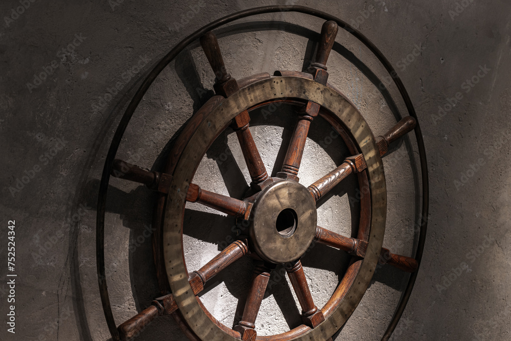 Vintage wooden steering wheel with brass details