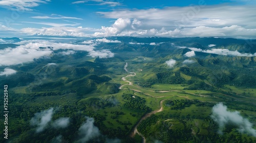 An awe-inspiring aerial view showcasing the splendor of nature and the importance of eco-friendly environments, with expansive mountains, verdant landscapes © artfisss