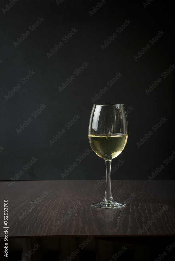 Strong drinks in three glasses on a wooden board with snacks Strong drinks in three glasses on a wooden board with snacks