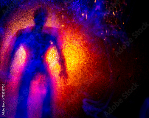 Human silhouettes between lights. Light painting in the dark.