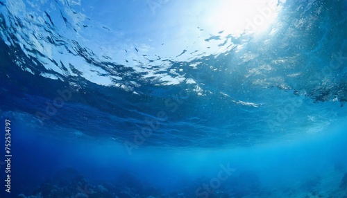Blue background of ocean water at depth.