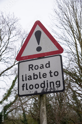 Road liable to flooding sign. warning sign to motorists during heavy rainfall. caution sign