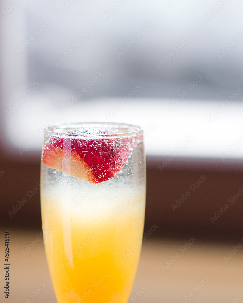 Berry-orange lemonade in a glass goblet Berry-orange lemonade in a glass goblet