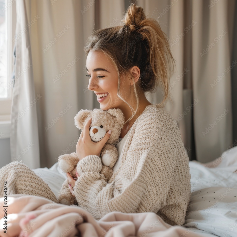 Serene young woman with a joyful smile hugging a teddy bear while relaxing at home Serene young woman with a joyful smile hugging a teddy bear while relaxing at home