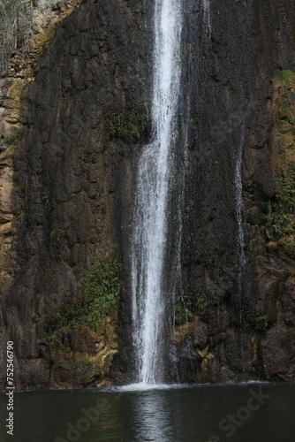 Waterfall cascade on mountain rocks 