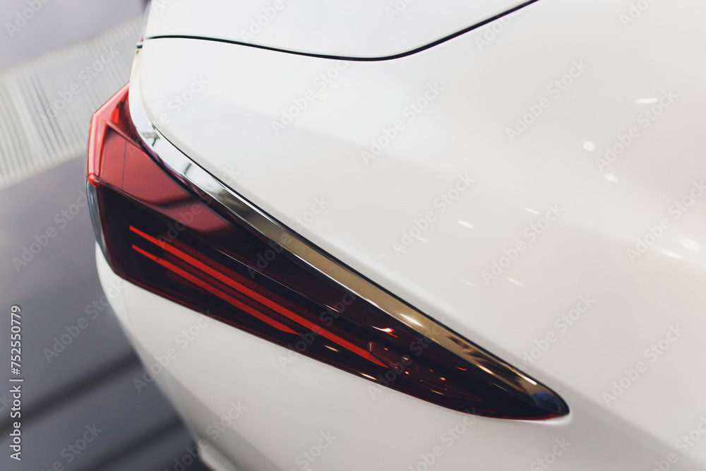 Obraz premium Car detail. New led taillight by night. The rear lights of the car, in hybrid sports car. Developed Car's rear brake light.
