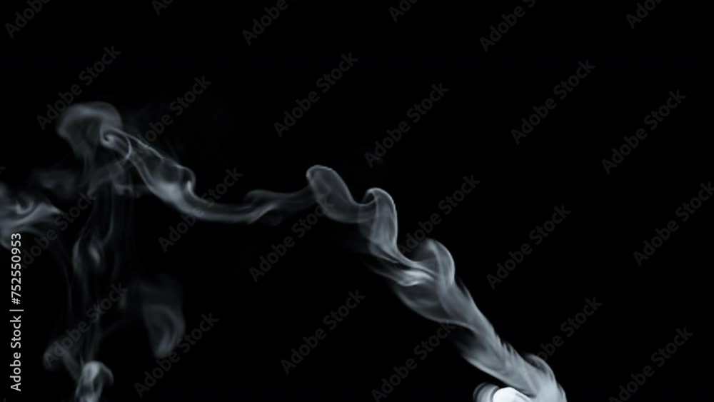 Wispy smoke on black background