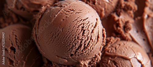 Indulgent scoop of rich chocolate ice cream on a cone, delicious frozen treat dessert