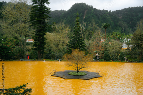 FURNAS, SAO MIGUEL, AZORES - 12.2.2024: People swimming in the hot thermal waters in Parque Terra Nostra photo