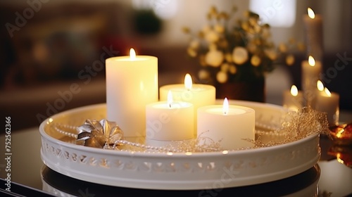 A tray with three lit candles on a table. Suitable for home decor or relaxation concepts