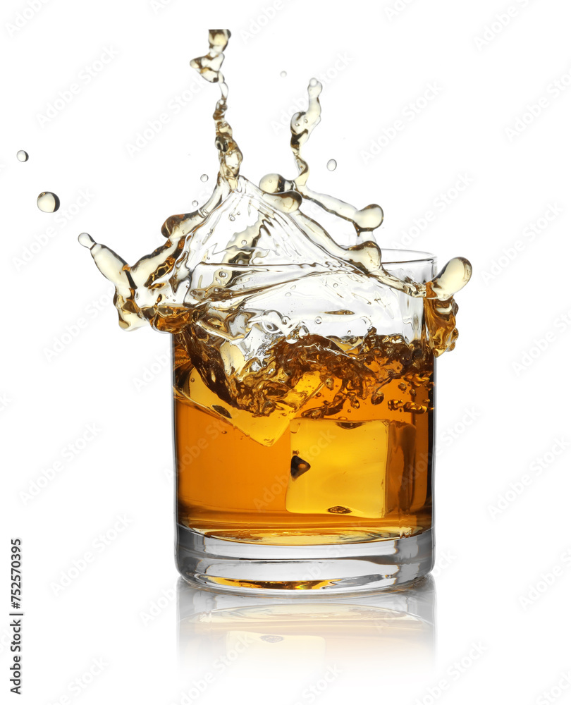 Whiskey splashing out of glass on white background Whiskey splashing out of glass on white background