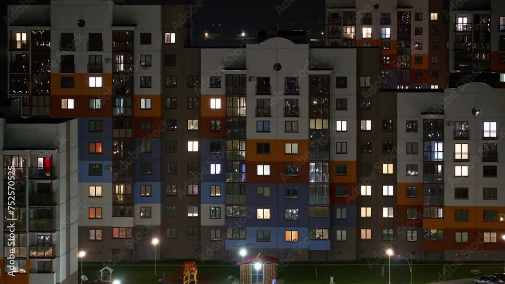 Night timelapse flickering light in the windows of an apartment building. Blinking light in the windows. The night city. Night timelapse flickering light in the windows of an apartment building. Blinking light in the windows. The night city.