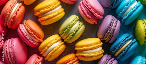 Vibrant close up of assorted colorful macarons on display at confectionery shop