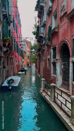 Medieval houses, narrow canals, bridges and gondolas in Venice, Italy, February 10, 2024. Vertical video. photo