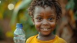 water problem in Africa, Happy African boy with plastic water bottle