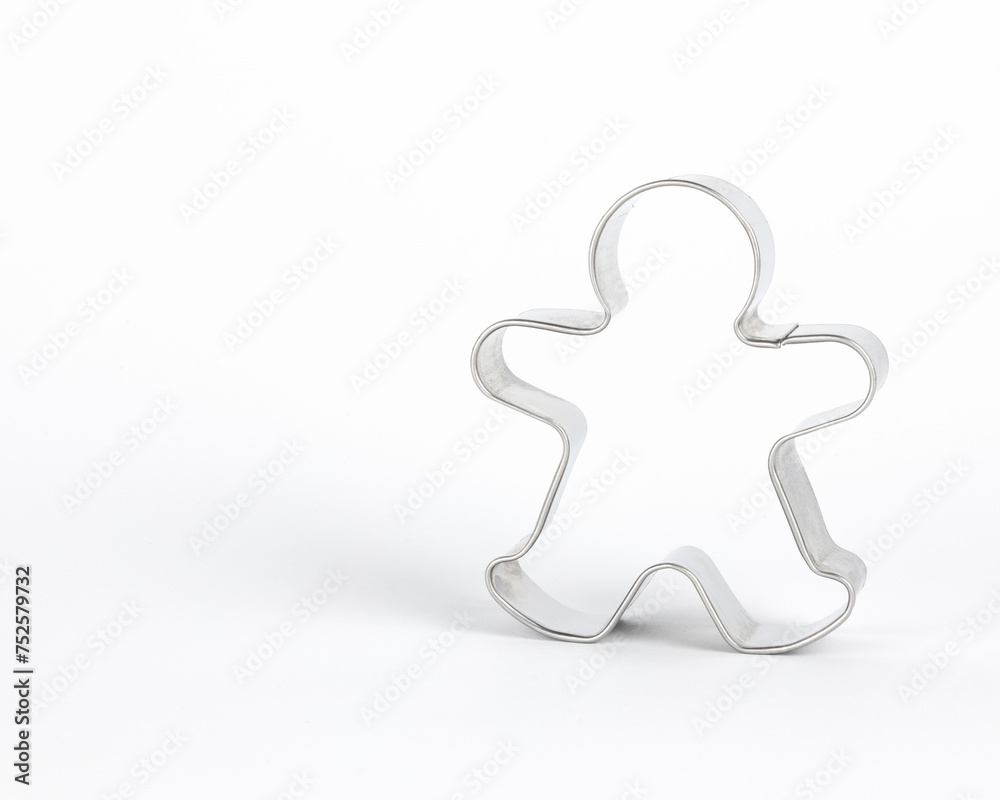 A metal mold for baking a gingerbread man. Concept of molds for baking cookies. A metal mold for baking a gingerbread man. Concept of molds for baking cookies.