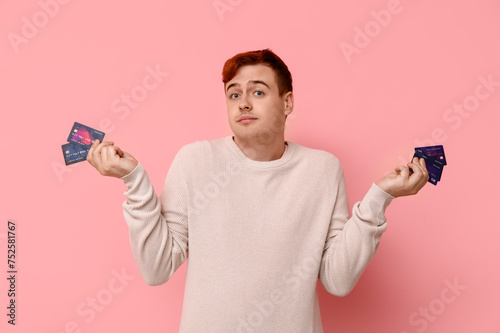 Confused young man with cre...