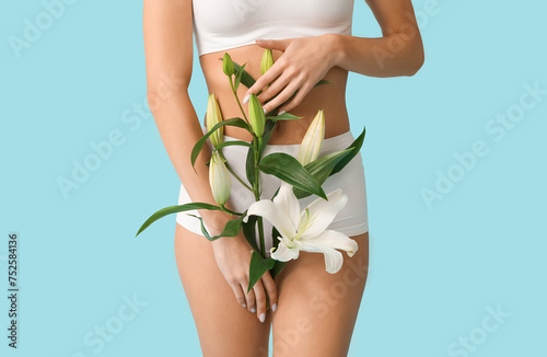 Young woman with white lily...