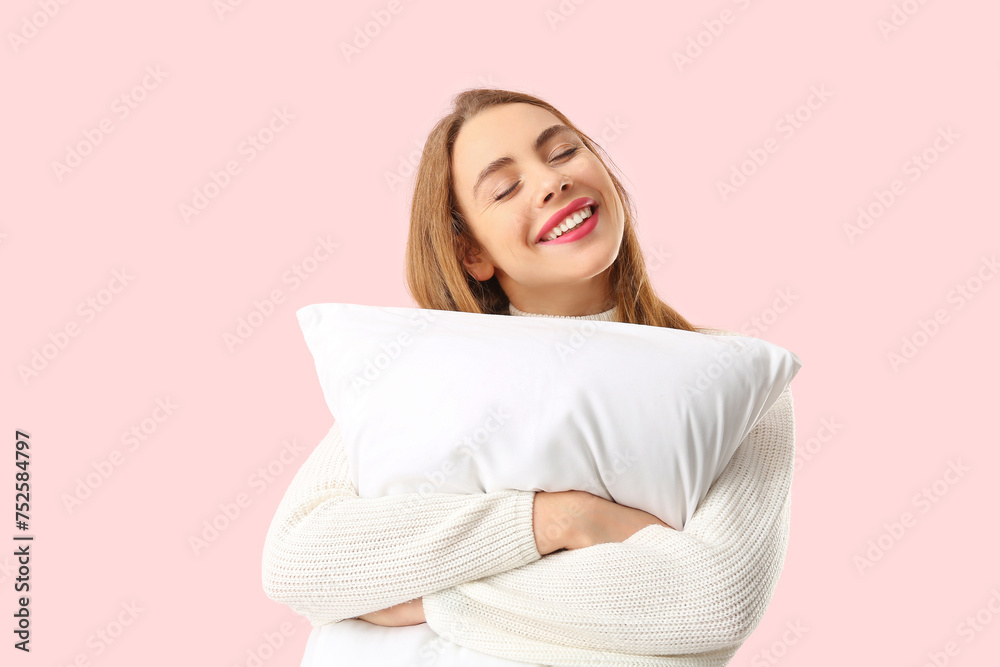 Beautiful young woman with white soft pillow on pink background Beautiful young woman with white soft pillow on pink background