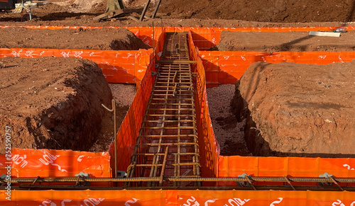 Obraz na płótnie Corner footings on construction site with steel reinforced concrete preparations. w salonie