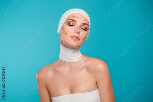 Photo of plastic surgery patient lady with medical bandage lines close eyes over cyan color background