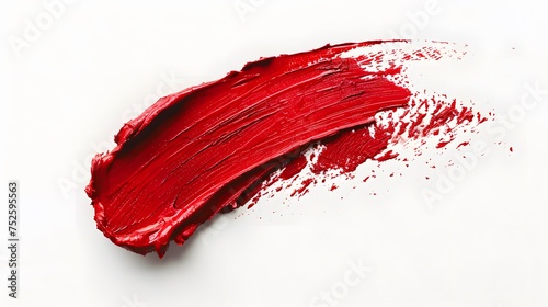 Red lipstick smear isolated on white background. Red color cosmetic product brush stroke swipe sample. Beauty makeup product texture. Top view