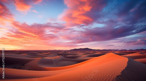 Sunset in the desert. Panoramic view of sand dunes