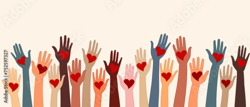 Raised hands of volunteer people holding a heart. People diversity. Charitable and donation. Support and assistance. Multicultural community. NGO. Aid. Help. Volunteerism.Teamwork. Banner © melita