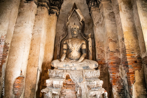 Buddha statues inside Wat Chaiwatthanaram temple in Ayutthaya Historical Park, Thailand photo
