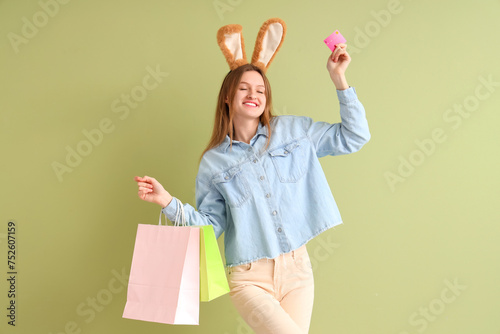 Young woman in bunny ears w...