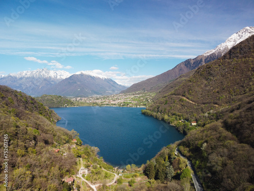 Swiss mountain lake in summer surrounded by lush green meadows and alpine peaks. photo