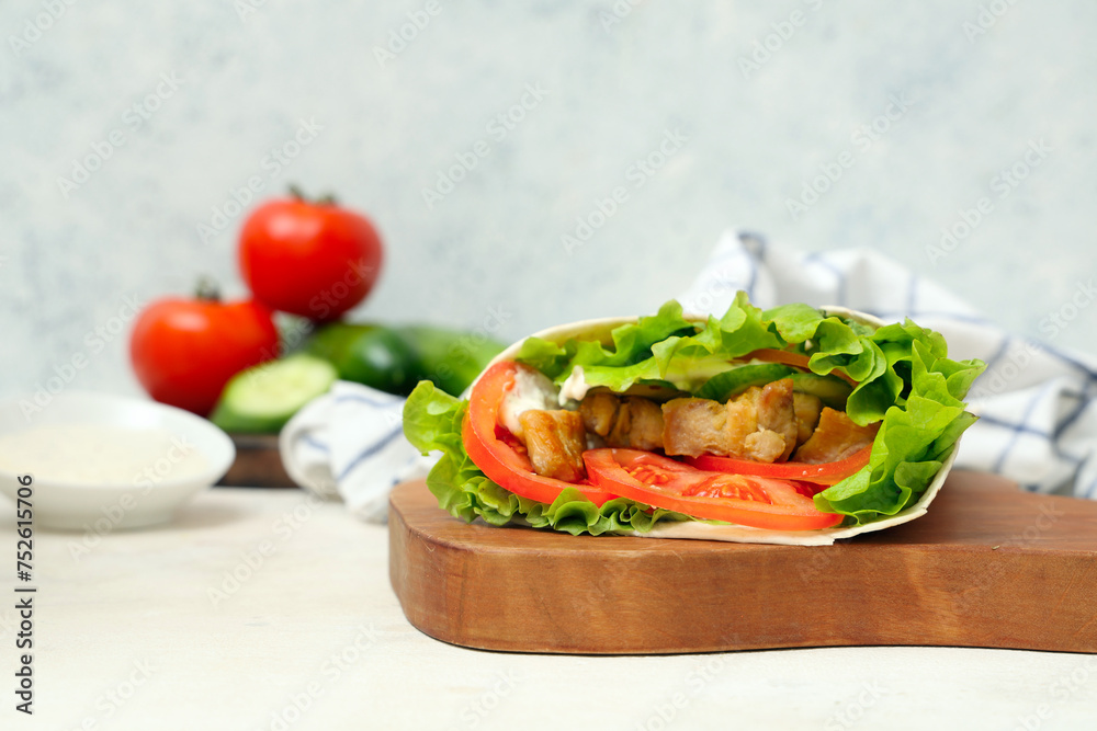 Board with tasty doner kebab on light table Board with tasty doner kebab on light table