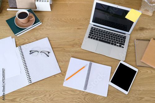 Workplace with laptop  notebooks and tablet in office