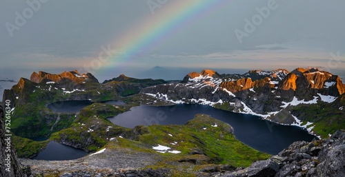 Evening mood with rainbow, mountain landscape with fjord and lake Krokvatnet, view from the top of Hermannsdalstinden, Moskenesoey, Lofoten, Nordland, Norway, Europe photo