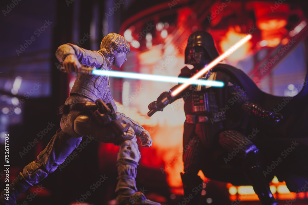 Naklejka premium NEW YORK USA, MAR 10 2024: recreation of a scene from Star Wars The Empire Strikes Back with Jedi Luke Skywalker battling Sith lord Darth Vader in the carbonite freezing chamber on Bespin - Hasbro