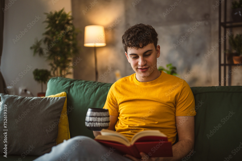 Young man caucasian teenager read book study at home education concept Young man caucasian teenager read book study at home education concept