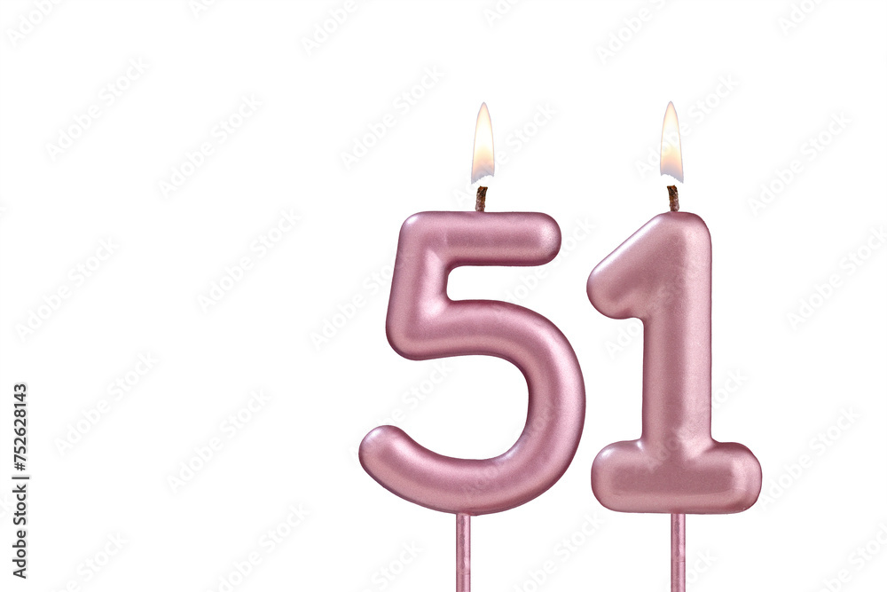 Lit birthday candle - Candle number 51 on white background Lit birthday candle - Candle number 51 on white background