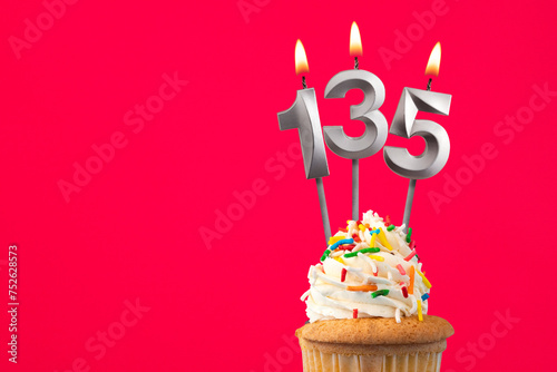 Burning candle number 135 - Birthday card with cupcake