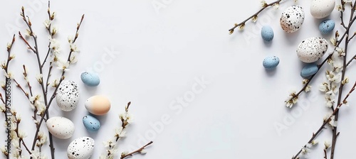 Flat lay easter composition with a willow branch and eggs on a white background, copy space