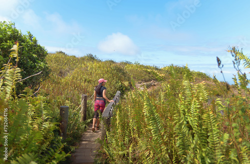 Person Walking on Wooden Trail at Mombacho Reserve
