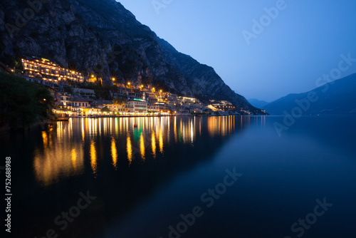 Limone Garda, Garda Lake, Lombardy, Italy in night.reflection of adjacent building in water photo